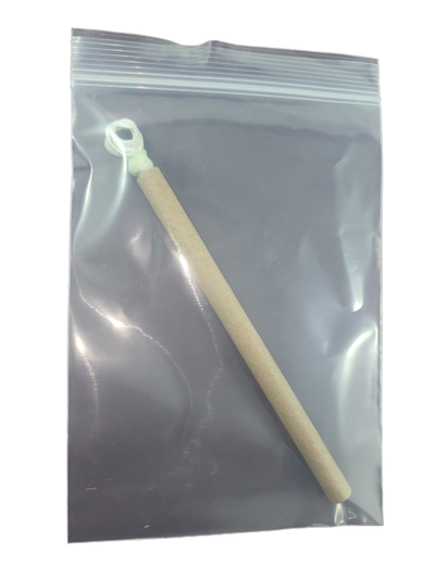 Doc's Sticky Lace - Waxed 4-Ply Void Drain Cord in its final retail form.  The stiff but sticky cord is protected within a rigid sheath itself within a poly sealed bag.  The extraction Eyelet is visible at the the top of the cord.