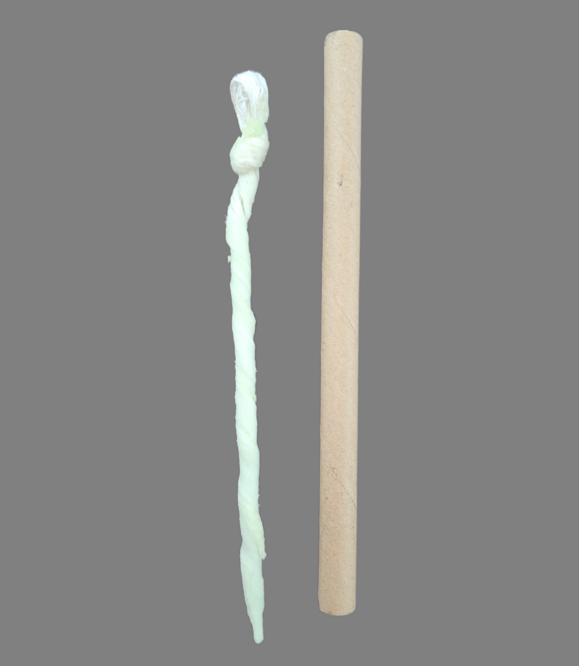 Doc's Sticky Lace - Waxed 4 Ply Drain-Void making cord is displayed next to its stiff sheath in which it is usually stored and shipped.