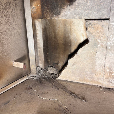 These broken fireplace tiles and bricks were preventing a house from being sold until Canadian Forge cast a stronger than original brick to restore the fireplace to better than original condition.