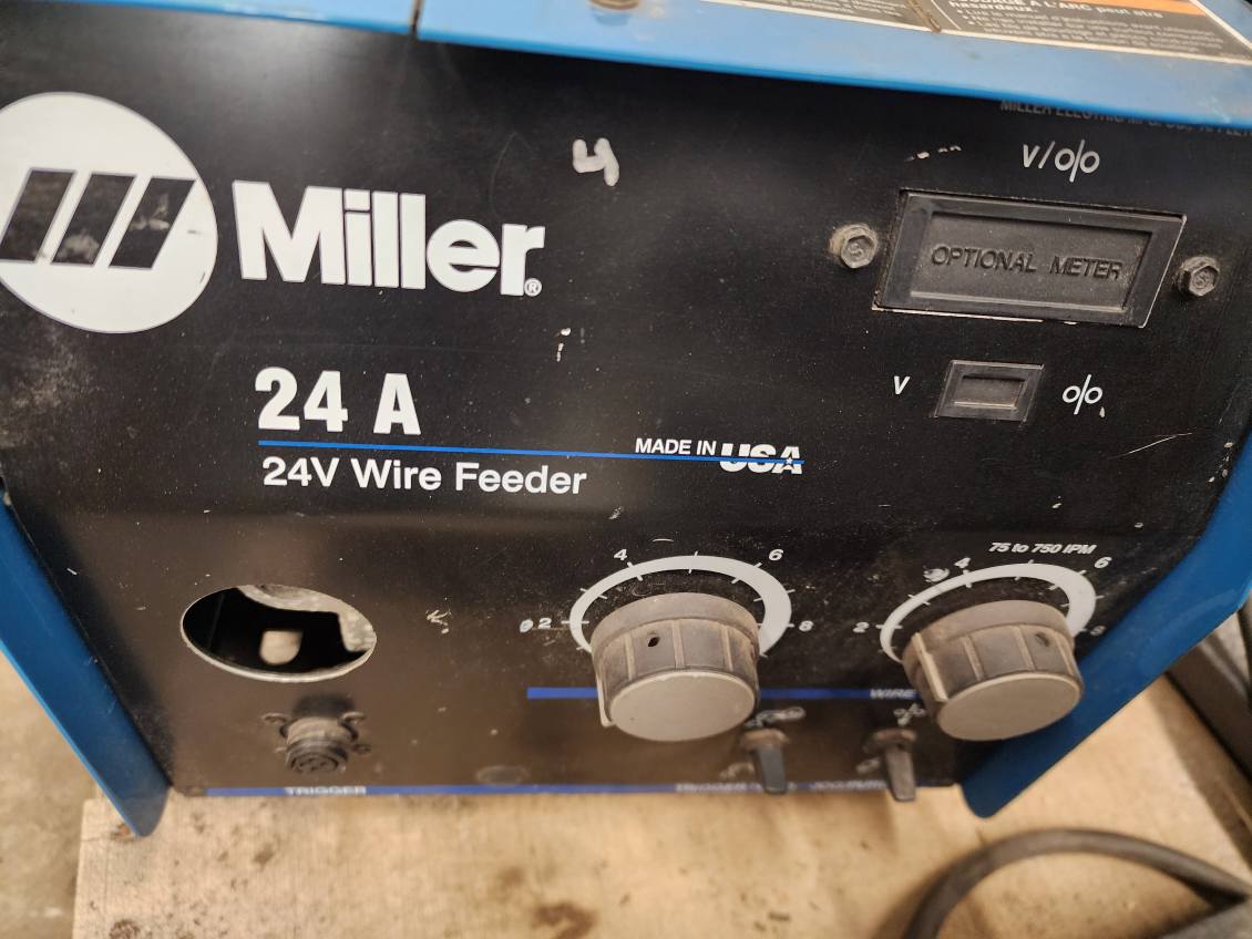 Skid of 5 used welding wireline Feeders.  4 Miller & 1 other.