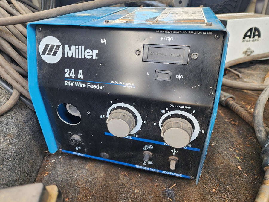 Skid of 5 used welding wireline Feeders.  4 Miller & 1 other.